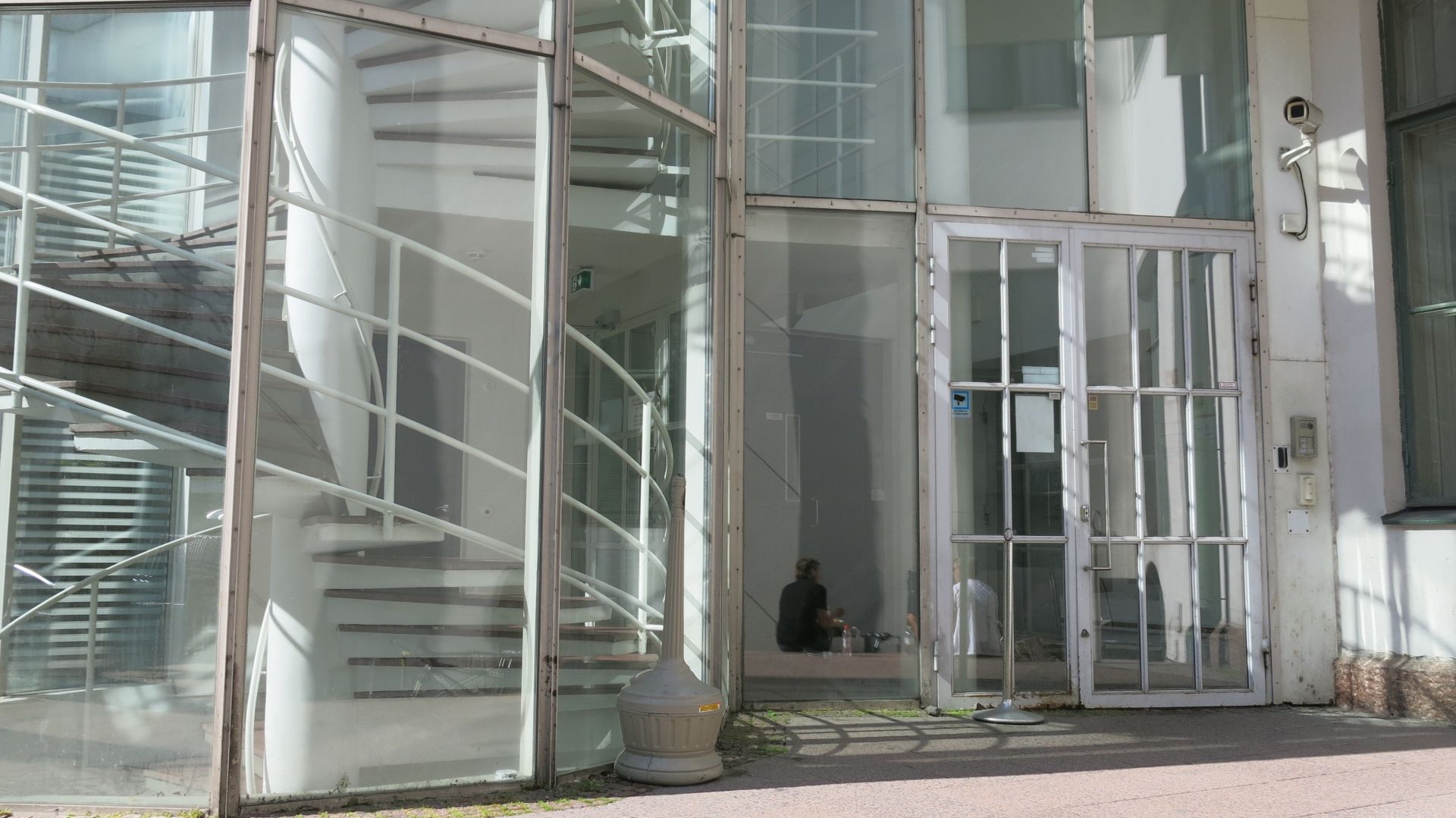 Glass door providing wheelchair access to the G18 building.